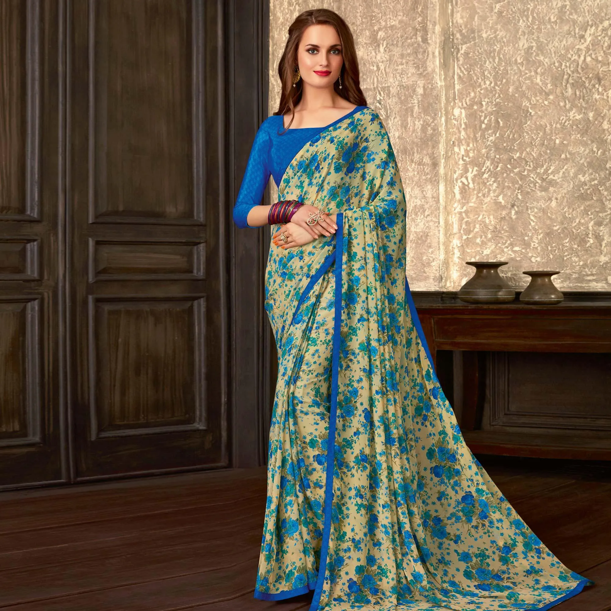 Blooming Beige-Blue Colored Casual Wear Floral Printed Georgette Saree