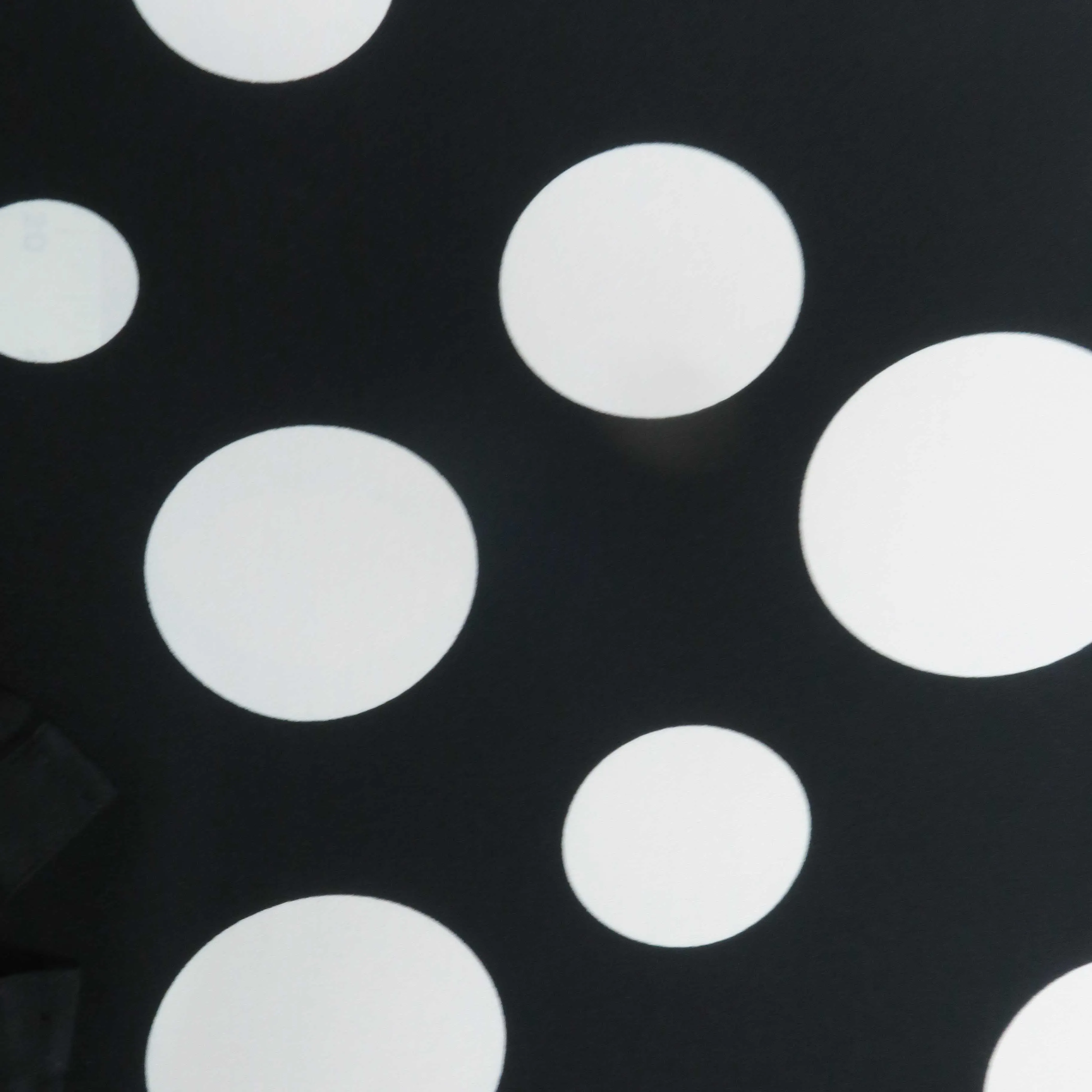 White Circles on Black Printed Polyester Crepe